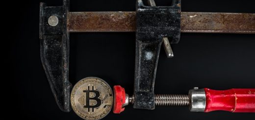 black and red caliper on gold colored bitcoin