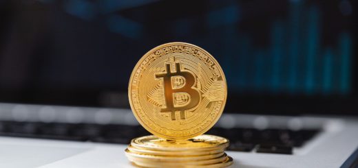selective focus of bitcoins on laptop computer